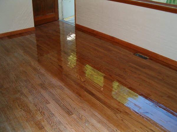 a hardwood floor in the process of being resurfaced
