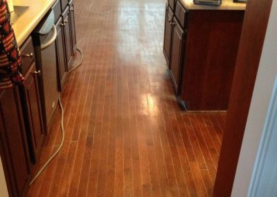 a damaged kitchen hardwood floor
