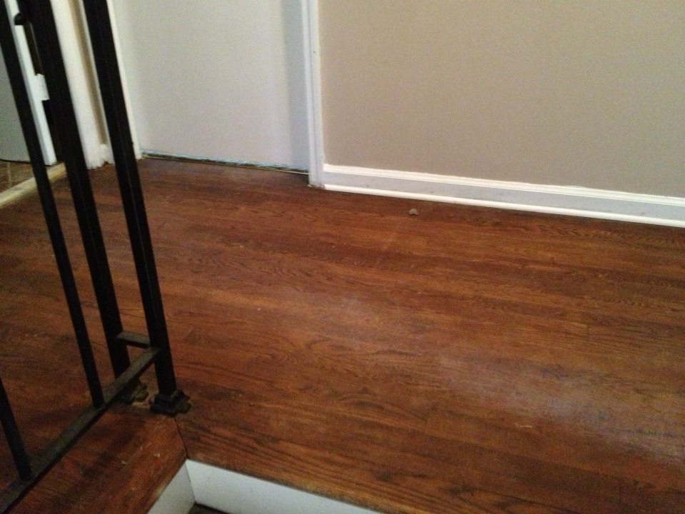 A hardwood floor in need of being refinished in milwaukee